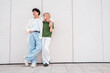 © halayalex - Smiling beautiful woman and her handsome boyfriend. Couple in casual summer clothes. Happy cheerful family. Female and man having fun. They posing in the street in sunny day. Having tender moments