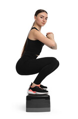 Poster - Young woman doing aerobic exercise with step platform on white background