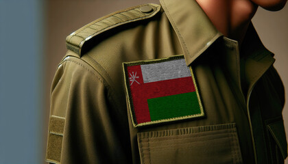 Wall Mural - A close-up of a military uniform with the Oman flag patch displayed prominently, representing service and patriotism