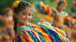 © Creative_Bringer - A young girl smiles as she performs in a colorful traditional Mexican dance costume with others in motion around her