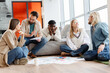 © Maria Vitkovska - Group of young creative people brainstorming during meeting in office