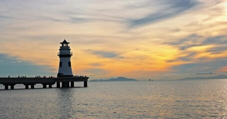 Wall Mural - Beautiful coastline and lighthouse building landscape at sunrise in Zhuhai, Guangdong Province, China. Famous holiday resort.