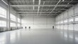 © abu - A wide shot of an empty factory hall with industrial air flow pipes and modern equipment