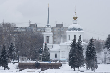 Wall Mural - City of Tver, Tver Oblast, Russia. Beautiful winter cityscape. View of the Resurrection Church and the monument to Afanasy Nikitin on the Volga River embankment. Sights of Tver. Cold frosty weather.