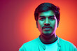 © Lustre Art Group  - Close-up portrait of young handsome Indian man looks at camera with light smile in neon light against gradient studio background. Concept of fashion and style, human emotions, business. Ad