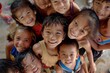 © Iigo - Group of asian children smiling and looking at the camera. Top view.