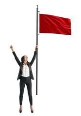 Sticker - A woman in a business suit triumphantly holding up a red flag, isolated on a white background