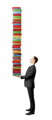 Aufkleber - A man in a suit holding a tall stack of colorful books on a white background, concept of knowledge and challenge