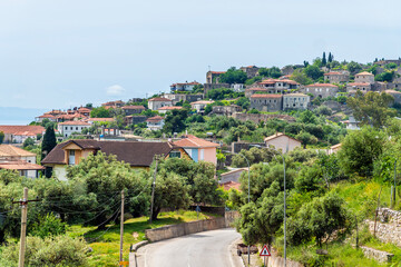 Wall Mural - A view of a seaside village on the road to Sarandra, Albania in summertime