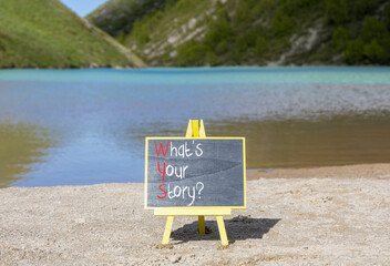 Fototapete - Storytelling and what is your story symbol. Concept words What is your story on beautiful yellow blackboard. Beautiful lake background. Business storytelling what is your story concept. Copy space