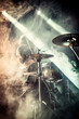 © smth.design - Rock Concert Drummer Performing on Stage with Smoke and Dramatic Lighting Effects