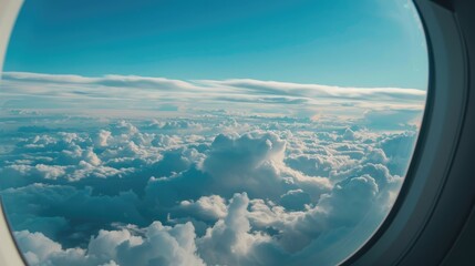 Wall Mural - blue sky and clouds seen from airplane window symbolizing tranquility and freedom