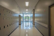 © forenna - modern minimalistic hallway in an elementary school. The lockers are uniformly arranged along the walls, and the neutral color palette of the walls and floor enhances the calm, ord