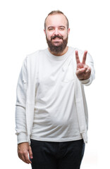 Sticker - Young caucasian hipster man wearing sport clothes over isolated background smiling with happy face winking at the camera doing victory sign. Number two.