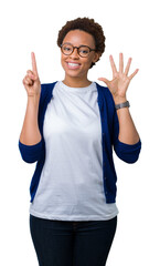 Sticker - Young beautiful african american woman wearing glasses over isolated background showing and pointing up with fingers number six while smiling confident and happy.