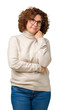 © Krakenimages.com - Beautiful middle ager senior woman wearing turtleneck sweater and glasses over isolated background with hand on chin thinking about question, pensive expression. Smiling with thoughtful face