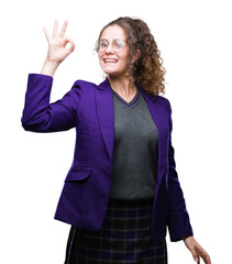 Poster - Young brunette student girl wearing school uniform and glasses over isolated background smiling positive doing ok sign with hand and fingers. Successful expression.