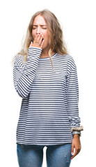 Canvas Print - Beautiful young blonde woman wearing stripes sweater over isolated background bored yawning tired covering mouth with hand. Restless and sleepiness.