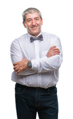 Canvas Print - Handsome senior man wearing bow tie over isolated background happy face smiling with crossed arms looking at the camera. Positive person.