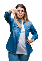 Sticker - Young beautiful woman over wearing glasses over isolated background looking unhappy and angry showing rejection and negative with thumbs down gesture. Bad expression.