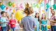 © scstay - kid stands with his back to the camera and wears a paper crown in a birth day in the kids crowd