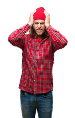 Poster - Young handsome man with long hair wearing red cap over isolated background suffering from headache desperate and stressed because pain and migraine. Hands on head.