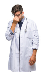 Wall Mural - Young handsome doctor man over isolated background tired rubbing nose and eyes feeling fatigue and headache. Stress and frustration concept.