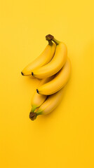 Wall Mural - Dense arrangement of bright, fresh, and juicy bananas in a minimalist photo, filling the frame and showcasing their vibrant yellow color and appetizing allure. Excellent for a background.

