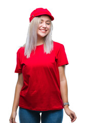 Sticker - Young blonde woman wearing red hat over isolated background looking away to side with smile on face, natural expression. Laughing confident.