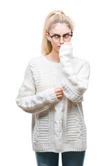 Canvas Print - Young beautiful blonde woman wearing glasses over isolated background looking stressed and nervous with hands on mouth biting nails. Anxiety problem.