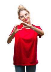 Sticker - Young beautiful blonde woman wearing red t-shirt and glasses over isolated background smiling in love showing heart symbol and shape with hands. Romantic concept.