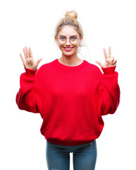 Sticker - Young beautiful blonde woman wearing red sweater and glasses over isolated background showing and pointing up with fingers number eight while smiling confident and happy.