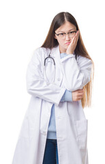 Canvas Print - Young Chinese doctor woman over isolated background thinking looking tired and bored with depression problems with crossed arms.