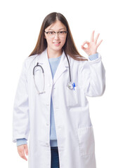 Wall Mural - Young Chinese doctor woman over isolated background smiling positive doing ok sign with hand and fingers. Successful expression.