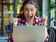 © Johannes - Excited young woman looking at laptop screen. Beautiful overjoyed girl feeling happy about her work.