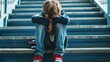 © Bijac - lonely school boy sitting on stairs victim of bullying childhood mental health concept