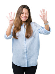 Wall Mural - Young beautiful brunette business woman over isolated background showing and pointing up with fingers number nine while smiling confident and happy.