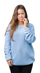 Poster - Young beautiful brunette woman wearing blue winter sweater over isolated background touching mouth with hand with painful expression because of toothache or dental illness on teeth. Dentist concept.