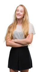 Poster - Blonde teenager woman wearing moles shirt happy face smiling with crossed arms looking at the camera. Positive person.