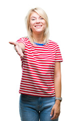 Sticker - Young beautiful blonde woman over isolated background smiling friendly offering handshake as greeting and welcoming. Successful business.