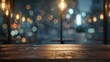 © BraveSpirit - Empty wooden table at a cozy cafe with city lights