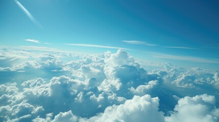 Wall Mural - blue sky and clouds seen from airplane window symbolizing tranquility and freedom