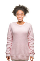 Poster - Young afro american woman wearing winter sweater over isolated background with a happy and cool smile on face. Lucky person.