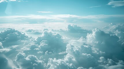 Wall Mural - blue sky and clouds seen from airplane window symbolizing tranquility and freedom