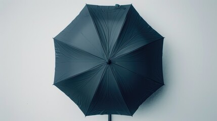 Poster - A simple and empty space with a black umbrella standing out