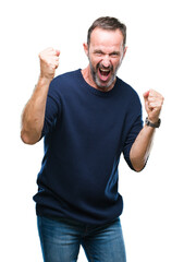 Canvas Print - Middle age hoary senior man over isolated background very happy and excited doing winner gesture with arms raised, smiling and screaming for success. Celebration concept.