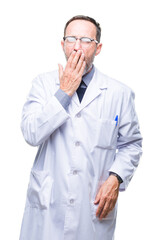 Canvas Print - Middle age senior hoary professional man wearing white coat over isolated background bored yawning tired covering mouth with hand. Restless and sleepiness.