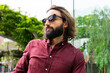 © ADDICTIVE STOCK - Stylish man in Poblenou with sunglasses and maroon shirt