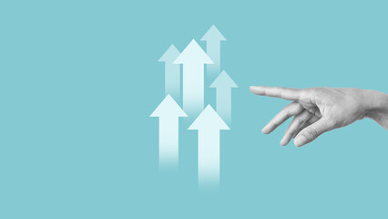 Poster - The hand shows the arrows pointing at creative business chart with upward arrows. Financial, business growth concept. Empty space for the text