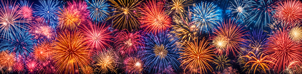 Wall Mural - Colorful fireworks display panorama, wide banner background